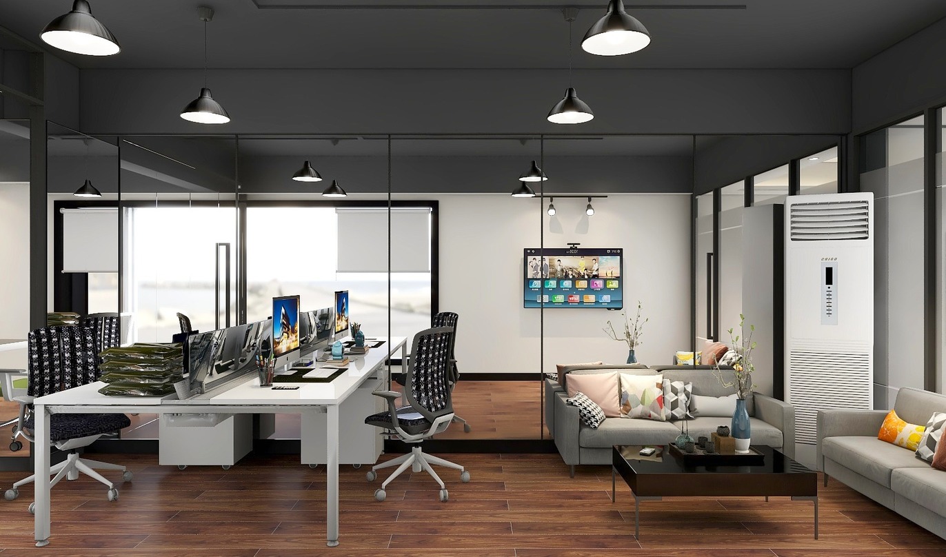图中是一个开放式办公室，办公室内有白灰色的办公桌，黑色的椅子，多台电脑，还有装饰画和沙发等。
